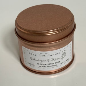 Homemade Candle Champagne & Roses Soy Tin Candle 100ml Tin. Front of candle with lid on.