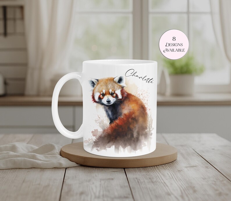 White ceramic mug personalised with the name “Charlotte” and featuring a striking red panda artwork in vibrant watercolour tones. A unique animal-themed gift for wildlife enthusiasts, red panda collectors and nature lovers. Suitable for birthdays, Christmas and other special occasions.