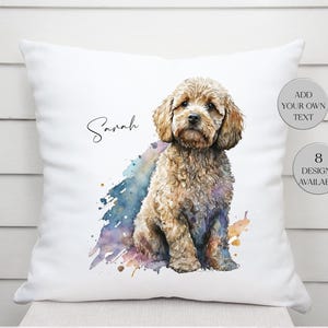 May include: White square throw pillow featuring a watercolor illustration of a brown dog. The dog is sitting with a colorful splash of paint behind it. The word "Sarah" is written in cursive. Text on the side says "Add your own text" and "8 designs available."