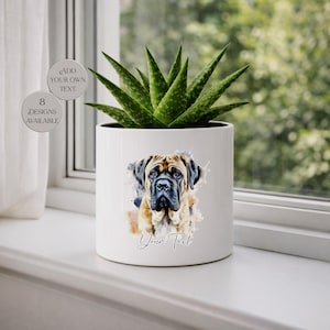 May include: A white ceramic plant pot with a watercolour illustration of a Mastiff dog. The pot contains a green succulent plant. The text "Your Text" is below the dog image. The image also includes text that says "Add Your Own Text" and "8 Designs Available".