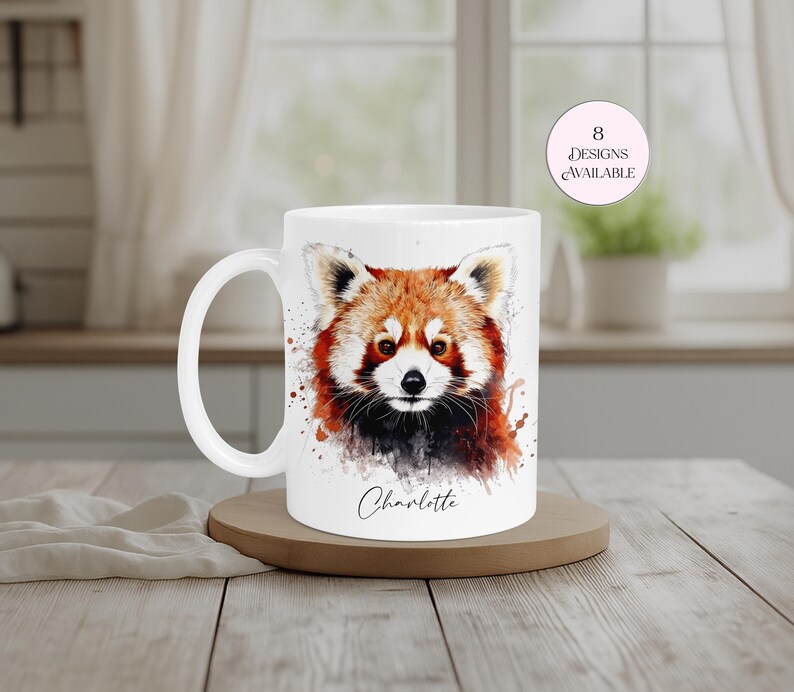 Cute personalised red panda mug showcasing a colourful watercolour illustration of one of the world's most loved animals. Customised with a name of your choice, this ceramic mug is perfect for animal lovers, wildlife fans and thoughtful personalised gifting. Eight designs available.