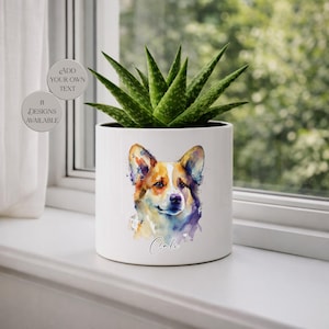 May include: White ceramic planter with a watercolor painting of a Corgi dog. The planter has a green succulent plant inside. The word "Cali" is written on the planter. The image also includes text that says "Add your own text" and "8 designs available."
