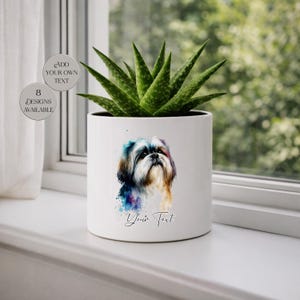 May include: A white ceramic plant pot featuring a watercolor portrait of a Shih Tzu dog. The pot contains a green succulent plant. Text on the pot reads "Your Text" and there are two circular text elements that read "Add Your Own Text" and "8 Designs Available".