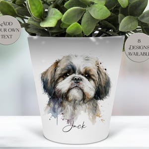 May include: White ceramic plant pot featuring a watercolor portrait of a Shih Tzu dog. The pot has the name "Jack" written on it. The pot also has the text "Add Your Own Text" and "8 Designs Available".