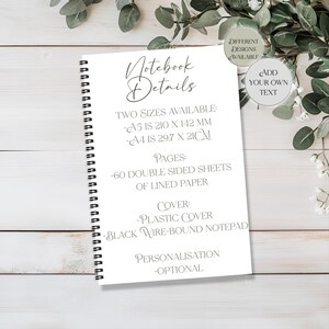 May include: A white notebook with black wire binding, displaying "Notebook Details." Available in A5 (210 x 142 mm) and A4 (29.7 x 21 cm) sizes. It contains 60 double-sided sheets of lined paper and a plastic cover. Personalisation is optional.