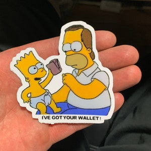 May include: A yellow cartoon sticker of Homer Simpson and Bart Simpson. Bart is holding a brown wallet and saying "I've got your wallet!"