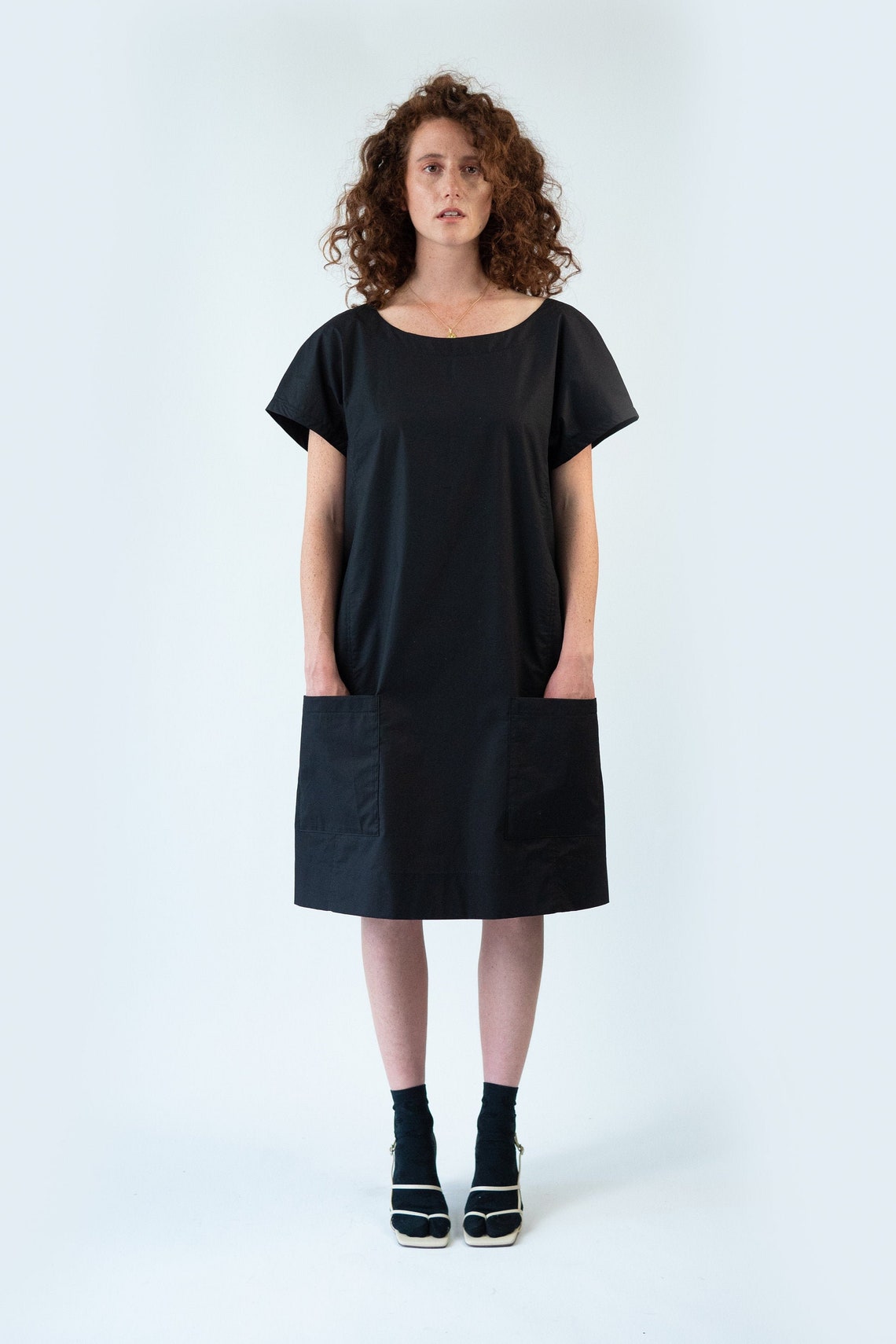 black tunic dress with pockets
