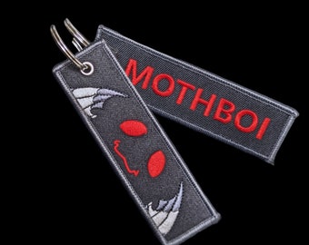 Cryptid jet tag keychains: Mothman, Deerman, Squonk, Nightcrawler