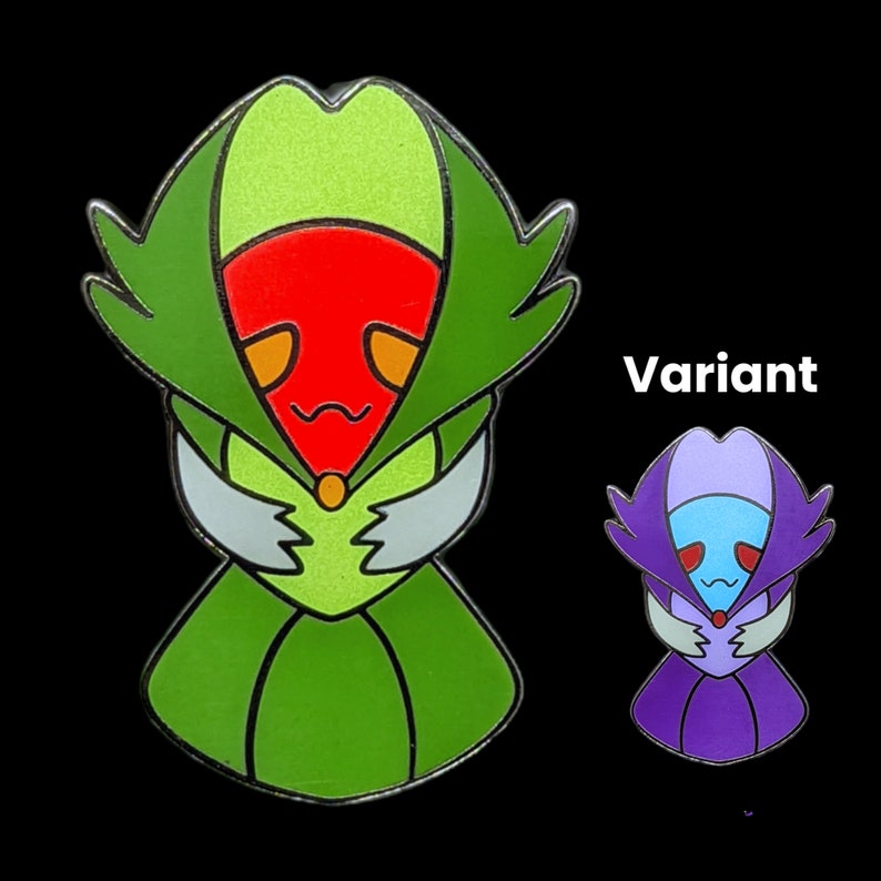 Pu&ograve; includere: Una spilla in smalto verde, rosso e bianco con un design di personaggio stilizzato. La spilla ha un contorno dettagliato e una finitura lucida. Viene mostrata anche una spilla variante pi&ugrave; piccola in viola e blu. La parola "Variant" &egrave; stampata in bianco.