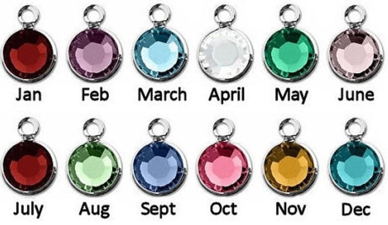 May include: Twelve round, silver charms with colored crystals, each representing a month of the year. January is red, February is purple, March is light blue, April is white, May is green, June is pink, July is dark red, August is light green, September is blue, October is pink, November is gold, and December is turquoise.