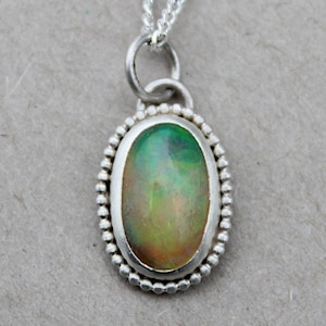 Pendant made of 935 silver with Welo Opal oval beads