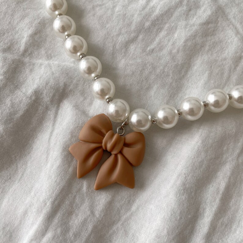Light Brown Beaded Necklace with Rainbow Pendant