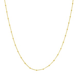 May include: A delicate gold necklace with a chain of small, evenly spaced beads. The necklace is a bright, shiny gold color and is displayed against a white background. The necklace is a simple, elegant piece of jewelry.