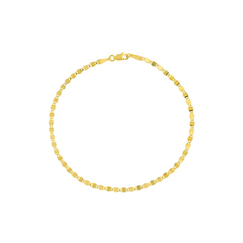 May include: A delicate gold bracelet with a repeating pattern of small, flat, oval-shaped links. The bracelet is a bright, shiny gold color and has a simple clasp closure. The jewelry is displayed against a white background.