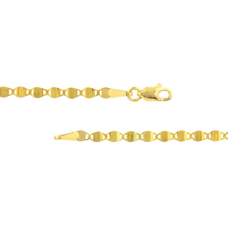 May include: A gold-colored necklace with a delicate, flat link chain design. The chain is composed of small, interconnected, oval-shaped links. The necklace features a lobster clasp closure. The jewelry is displayed against a white background.