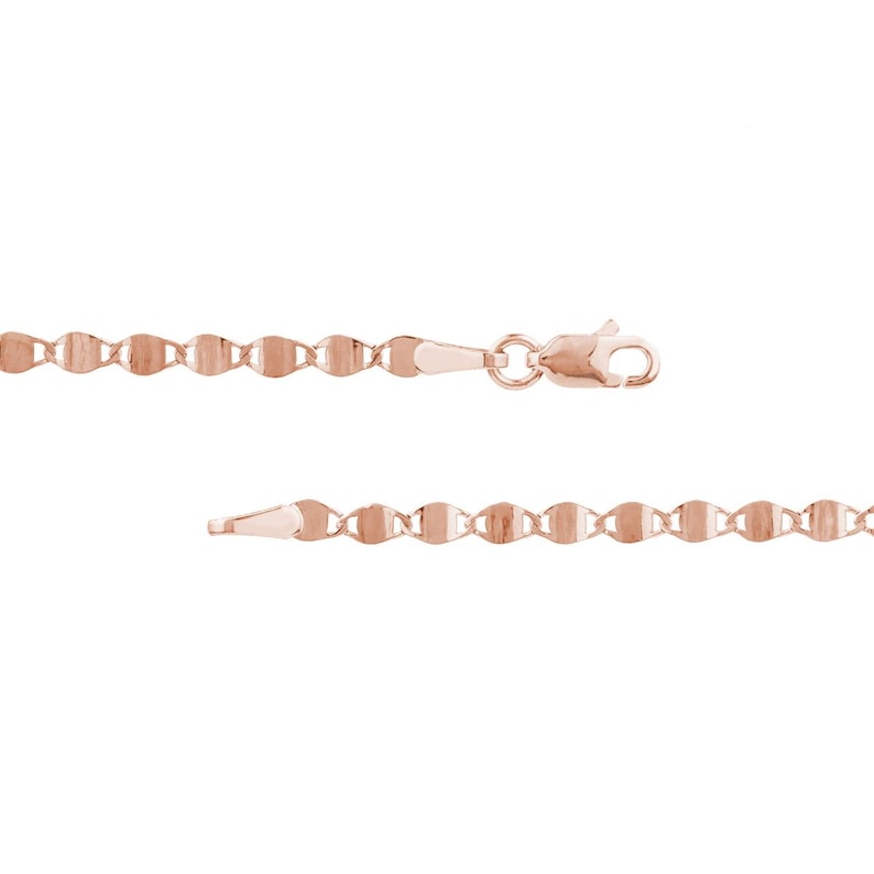 May include: A rose gold necklace with a delicate, flat-link chain design. The chain features a series of interconnected, oval-shaped links, and a lobster clasp closure. The necklace is displayed against a white background.
