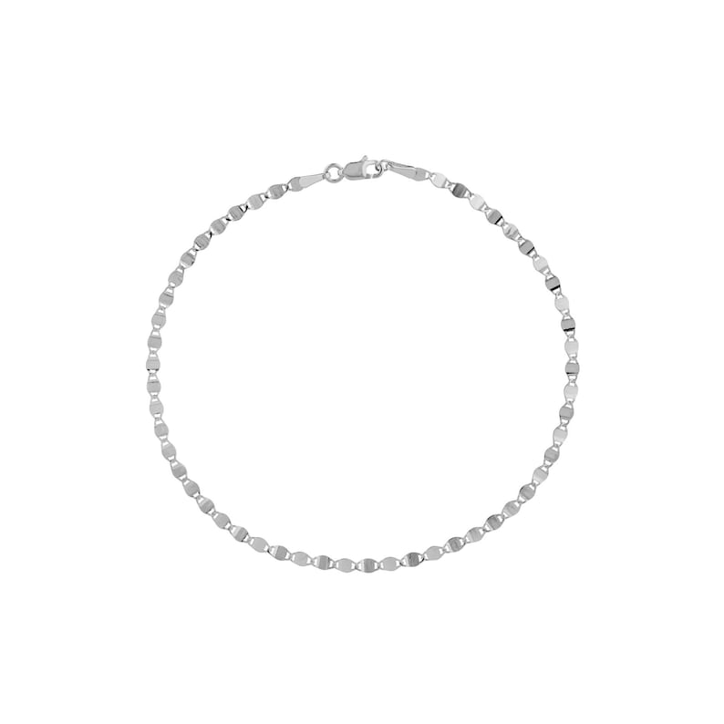 May include: A delicate silver bracelet with a repeating oval link design. The bracelet is made of a shiny, reflective metal and features a small clasp. The jewelry is displayed on a white background.