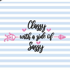 May include: Embroidery design featuring a black arrow with pink hearts and the text "Classy with a side of Sassy".