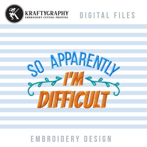 May include: Embroidery design featuring the text "So Apparently I'm Difficult" in blue and orange lettering with green leafy vines. The design is on a blue and white striped background.