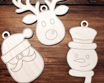 May include: Three unfinished wooden Christmas ornaments: a reindeer, Santa Claus, and a snowman. The ornaments are ready to be painted or decorated.