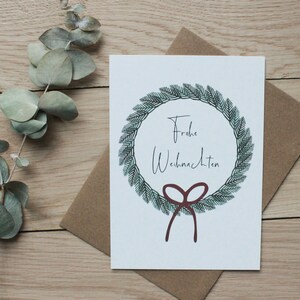 Weihnachtskarte [Frohe Weihnachten], Kranz mit Schleife, Postkarte mit Umschlag