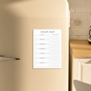 May include: A black and white printable menu planner with the text "MEN&Uuml;PLANER" at the top. The planner is divided into two columns, one for the days of the week and one for meal ideas.