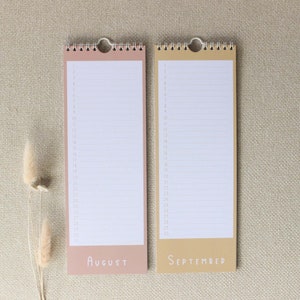 May include: Two blank monthly calendars, one in peach and one in beige, with the months August and September printed at the bottom.