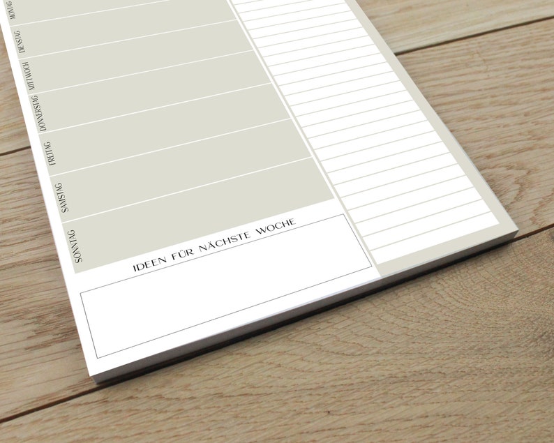 May include: A weekly planner with a light gray background and black lines. The days of the week are listed in German: Sonntag, Montag, Dienstag, Mittwoch, Donnerstag, Freitag, Samstag. The planner has a section at the bottom labeled "Ideen f&uuml;r n&auml;chste Woche" for writing down ideas for the next week.