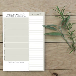 May include: A white printable meal planner with the text "MEN&Uuml;PLANER GUT GEPLANE IST HALB GEKOCHT!" and a grocery list section. The planner has a section for each day of the week and a section for ideas for the next week.