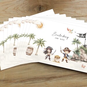May include: A stack of white invitation cards with a pirate theme. The cards feature illustrations of two pirates, palm trees, a treasure chest, and a pirate ship. The text on the card reads "Einladung f&uuml;r dich".