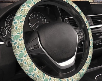 Coprivolante in stile William Morris con motivo floreale nei toni del beige, blu e verde acqua. Accessorio femminile per auto.