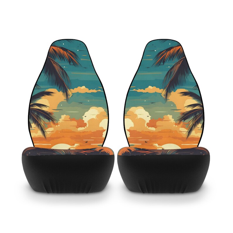 May include: Two black car seat covers with a sunset and palm tree design. The design features a blue sky, orange clouds, and a yellow sunset.