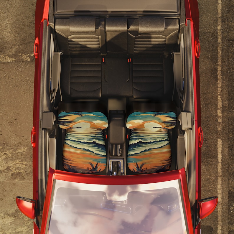 May include: Two car seat covers with a tropical beach scene design. The covers feature palm trees, waves, and a sunset. The covers are in a red, orange, yellow, blue, and green color scheme.