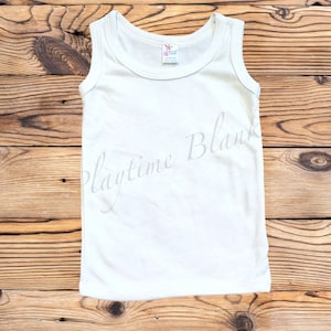 May include: White sleeveless tank top on a wooden background. The tank top is blank and ready for customization.