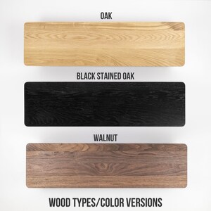 May include: Three wood samples showing different wood types and colors: oak, black stained oak, and walnut.  WOOD TYPES/COLOR VERSIONS is written below the samples.