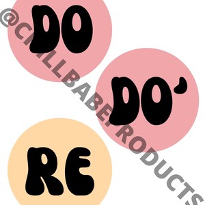 May include: Three round stickers with the words "DO", "DO'" and "RE" in black, bubble-like letters. The "DO" stickers are on a pink background and the "RE" sticker is on a light orange background.