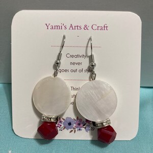 Dangling: opposite teardrop glass beads