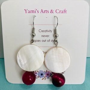 Dangling: opposite teardrop glass beads