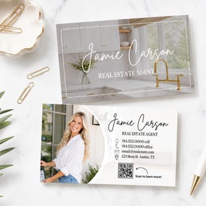 May include: Two rectangular business cards for a real estate agent named Jamie Carson. One card features a kitchen interior photo with gold faucet. The other card displays a portrait, contact details, a QR code, and the text Scan to learn more.
