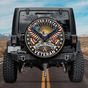 May include: A black Jeep with a spare tire cover featuring a patriotic design. The cover displays a bald eagle with outstretched wings, the text "UNITED STATES VETERAN," and the American flag.