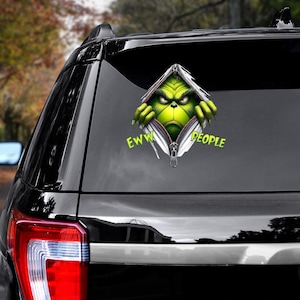 May include: A green Grinch character peeking out of a ripped zipper with the text "EWW PEOPLE" on a black car.