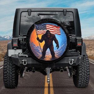 Bigfoot USA Flag Spare tire cover camera hole option,Bronco Bigfoot Spare tire cover,American Flag Sasquatch tire cover,Yeti Tire Cover