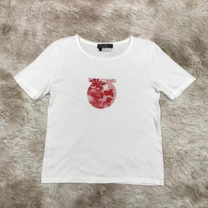 Camiseta vintage Salvatore Ferragamo con logo del mapa del mundo en algodón blanco para mujer talla L fabricada en Italia