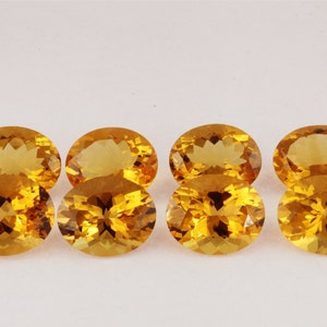 May include: Six oval-shaped, faceted, golden citrine gemstones.