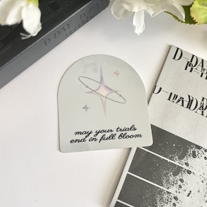Que vos épreuves se terminent en pleine floraison - Sticker holographique