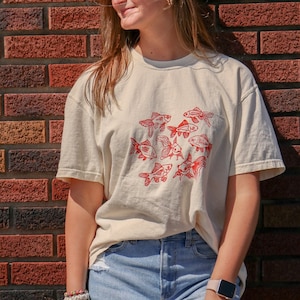 Light Fishy | off white & orange short sleeve comfort colors