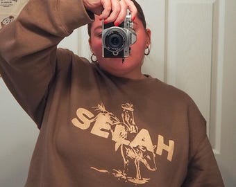 Selah Cowboy Bull Rider Crewneck | Brown Off-white Cream Screen Print Sweatshirt