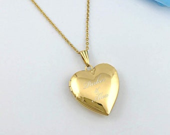 May include: A gold heart-shaped locket necklace with the inscription "Parker & Alice" on the front.