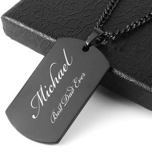 May include: Black dog tag necklace with the name "Michael" and the text "Best Dad Ever" engraved on it.