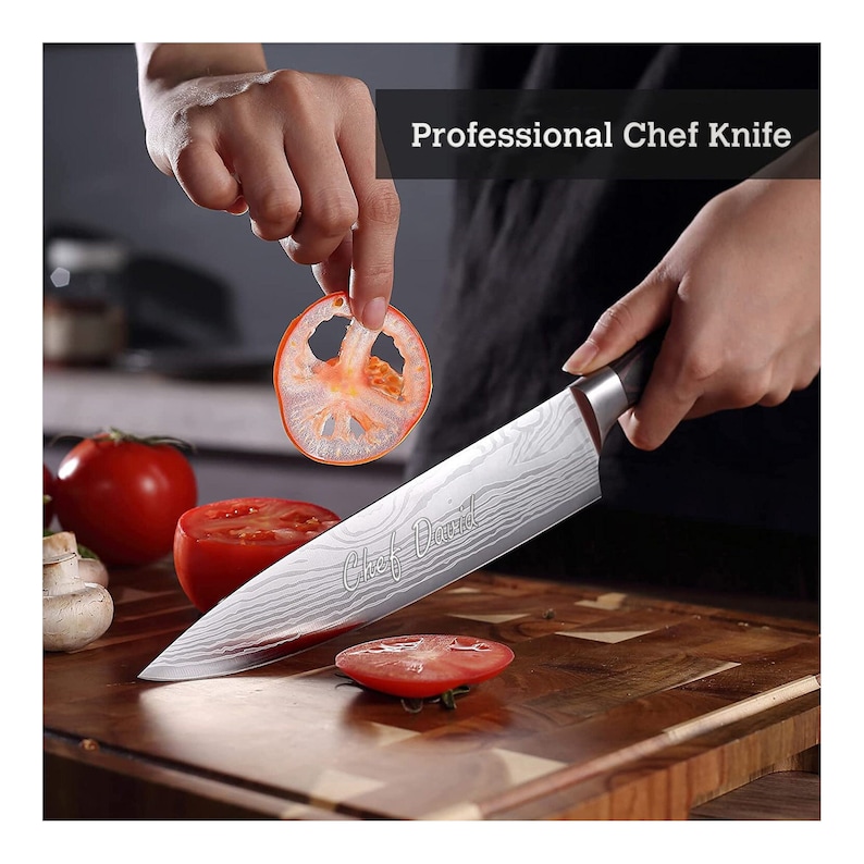 May include: A professional chef knife with a patterned blade is slicing a tomato. The knife has a dark handle and the text "Chef David" etched on the blade. The image also shows sliced tomatoes and a cutting board.